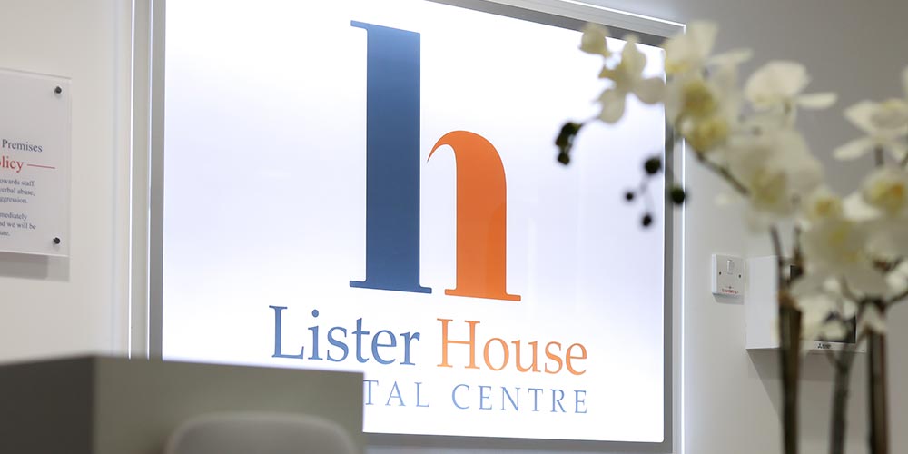 lister house dental logo in illuminated behind reception desk