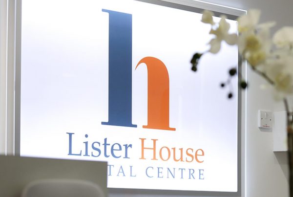 lister house dental logo in illuminated behind reception desk